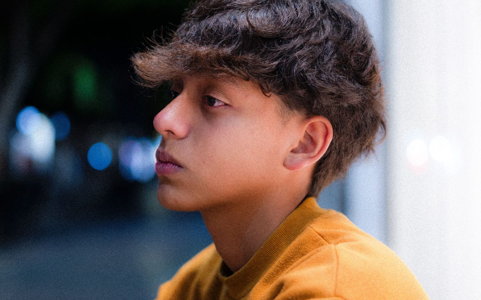 A young person looking towards the camera