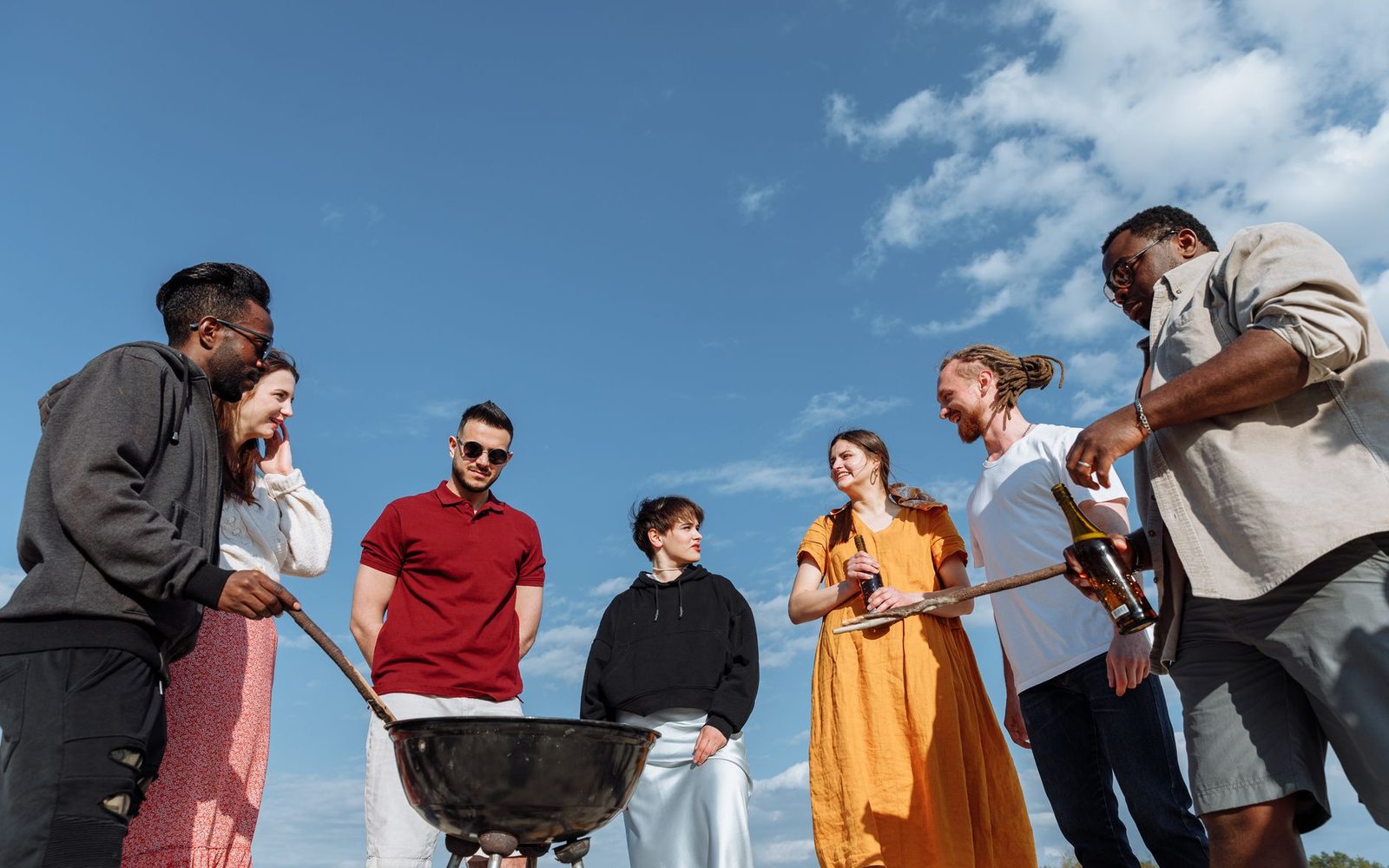 A group of people talking together outdoors
